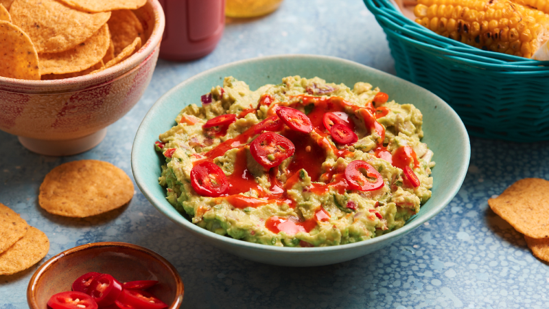 Chunky Chilli Guacamole served with nachps around